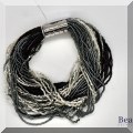 J161. Multi strand seed beaded bracelet with silver clasp. - $28 